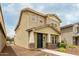 A two-story home with a modern design, appealing color scheme, and landscaped front yard at 13380 N 148Th Ave, Surprise, AZ 85379