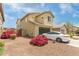 Beautiful two-story home with a well-manicured front yard and neutral color palette at 13380 N 148Th Ave, Surprise, AZ 85379