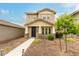 Charming two-story home with well-maintained landscaping and a welcoming entrance at 13380 N 148Th Ave, Surprise, AZ 85379
