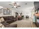 Open concept living space featuring a cozy seating area and a view into the modern kitchen at 13380 N 148Th Ave, Surprise, AZ 85379