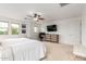 Bright main bedroom with plush carpet, ceiling fan, and ample closet space at 13380 N 148Th Ave, Surprise, AZ 85379