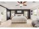 Spacious main bedroom with a large bed, stylish decor, and abundant natural light at 13380 N 148Th Ave, Surprise, AZ 85379