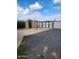 The gravel-covered backyard features an open shed and privacy gate, perfect for versatile outdoor use at 138 E Monte Way, Phoenix, AZ 85042
