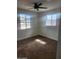 Bedroom featuring new carpet, a ceiling fan, and natural light from windows at 138 E Monte Way, Phoenix, AZ 85042