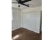 Bedroom featuring new carpet, a ceiling fan, and double door closet at 138 E Monte Way, Phoenix, AZ 85042