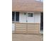 Close up of front door with window and painted horizontal privacy fence at 138 E Monte Way, Phoenix, AZ 85042