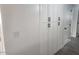 Hallway view with large storage cabinets and new door at 138 E Monte Way, Phoenix, AZ 85042
