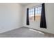 Bedroom features a large window that lets in natural light and a plush gray carpet at 15240 N 142Nd Ave # 2171, Surprise, AZ 85379