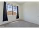 Comfortable bedroom features natural light from the window and neutral walls and carpet at 15240 N 142Nd Ave # 2171, Surprise, AZ 85379