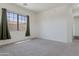 Comfortable bedroom with a window and neutral walls and carpet at 15240 N 142Nd Ave # 2171, Surprise, AZ 85379