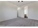 Spacious bedroom with neutral walls and carpet, leading to an en-suite bathroom at 15240 N 142Nd Ave # 2171, Surprise, AZ 85379