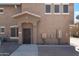 Exterior view of front door, rock landscaping, and visible utilities at 15240 N 142Nd Ave # 2171, Surprise, AZ 85379