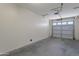 Spacious two-car garage with an automatic door, ready to accommodate vehicles and storage at 15240 N 142Nd Ave # 2171, Surprise, AZ 85379
