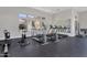 Fitness center with cardio machines, large mirrors, ample lighting, and floor-to-ceiling windows at 15240 N 142Nd Ave # 2171, Surprise, AZ 85379