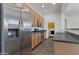 Stainless steel refrigerator, oven, counter, and ample cabinet space and in-kitchen laundry at 15240 N 142Nd Ave # 2171, Surprise, AZ 85379