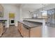 Kitchen area with stainless steel appliances, dishwasher, and pass through to the living area at 15240 N 142Nd Ave # 2171, Surprise, AZ 85379