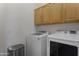 Laundry room features a modern washer and dryer set with plenty of space at 15240 N 142Nd Ave # 2171, Surprise, AZ 85379