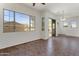 Sunlit living room with large windows, sliding glass door, and neutral paint at 15240 N 142Nd Ave # 2171, Surprise, AZ 85379