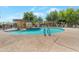 Community pool with clear water and tiled steps, ideal for a relaxing day outdoors at 15240 N 142Nd Ave # 2171, Surprise, AZ 85379