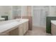 Spacious bathroom featuring a large mirror, shower with glass door, and double vanity at 15252 N 100Th St # 1172, Scottsdale, AZ 85260