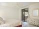 Bright bedroom with sliding glass doors to a patio and light-colored furniture at 15252 N 100Th St # 1172, Scottsdale, AZ 85260