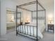 Cozy bedroom with a four-poster bed, mirrored closet, and stylish nightstand at 15252 N 100Th St # 1172, Scottsdale, AZ 85260