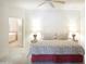 Bedroom featuring a plush bed, ambient lighting, and an open doorway to the bathroom at 15252 N 100Th St # 1172, Scottsdale, AZ 85260