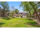 Expansive community grounds with manicured lawns, mature trees, pool area, and well-maintained buildings at 15252 N 100Th St # 1172, Scottsdale, AZ 85260
