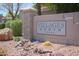 Welcoming stone sign for Villages North community with desert landscaping at 15252 N 100Th St # 1172, Scottsdale, AZ 85260