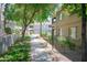 Scenic walkway lined with trees and bushes leading to the community pool and other amenities at 15252 N 100Th St # 1172, Scottsdale, AZ 85260