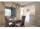 Warm dining area blending into the kitchen, lit by a stylish pendant light, with ample natural light at 15252 N 100Th St # 1172, Scottsdale, AZ 85260