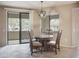 Cozy dining area with modern pendant lighting and sliding door access to the outside at 15252 N 100Th St # 1172, Scottsdale, AZ 85260