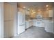 Spacious kitchen featuring lots of cabinets, a white refrigerator and ample countertop space at 15252 N 100Th St # 1172, Scottsdale, AZ 85260
