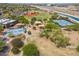 Aerial view of a park with playgrounds, picnic areas, and sports courts that offer recreational opportunities for residents at 15252 N 100Th St # 1172, Scottsdale, AZ 85260