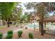 Outdoor community pool with multiple chairs, tables and landscaped surroundings offer a refreshing experience at 15252 N 100Th St # 1172, Scottsdale, AZ 85260