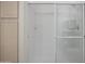 Shower encased in a glass frame featuring a shower head and storage at 15252 N 100Th St # 1172, Scottsdale, AZ 85260
