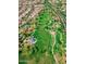 Aerial view of a neighborhood park with winding paths, mature trees, and a blue gazebo, surrounded by houses at 15416 W Valentine St, Surprise, AZ 85379