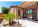 Charming backyard area with a small garden and a covered patio for relaxation at 15416 W Valentine St, Surprise, AZ 85379