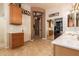 The spacious bathroom offers tile flooring, a large mirror, neutral cabinets, and entryways to the hall and closet at 15416 W Valentine St, Surprise, AZ 85379