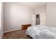 Cozy bedroom featuring carpet flooring, a chest of drawers, and a neutral color scheme at 15416 W Valentine St, Surprise, AZ 85379