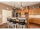 Beautiful kitchen with granite countertops, stainless steel appliances, and pendant lighting at 15416 W Valentine St, Surprise, AZ 85379