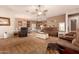 Open-concept living room showcases great flow to the kitchen and dining area; great for entertaining or Gathering gatherings at 15416 W Valentine St, Surprise, AZ 85379