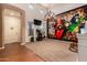 Spacious living room with unique accent wall, high ceilings, and neutral carpeting at 15416 W Valentine St, Surprise, AZ 85379