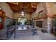 Spacious lobby with fireplace, high ceilings, and ample seating for gatherings and relaxation at 15416 W Valentine St, Surprise, AZ 85379