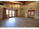 Community center meeting room featuring wood flooring, multiple exit points, and natural light at 15416 W Valentine St, Surprise, AZ 85379