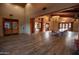 Spacious meeting room with wooden floors, large windows, and ample seating for gatherings at 15416 W Valentine St, Surprise, AZ 85379