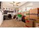 Spacious office with natural light, fan, desk, chair, and storage for a productive workspace at 15416 W Valentine St, Surprise, AZ 85379