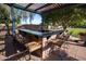 Outdoor bar area complete with seating, a built-in counter, and overhead pergola at 15416 W Valentine St, Surprise, AZ 85379
