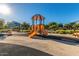 Modern playground with slides, swings, and a covered structure, perfect for outdoor activity at 15416 W Valentine St, Surprise, AZ 85379