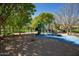 Community playground with a green slide and play equipment on a sand surface at 15416 W Valentine St, Surprise, AZ 85379